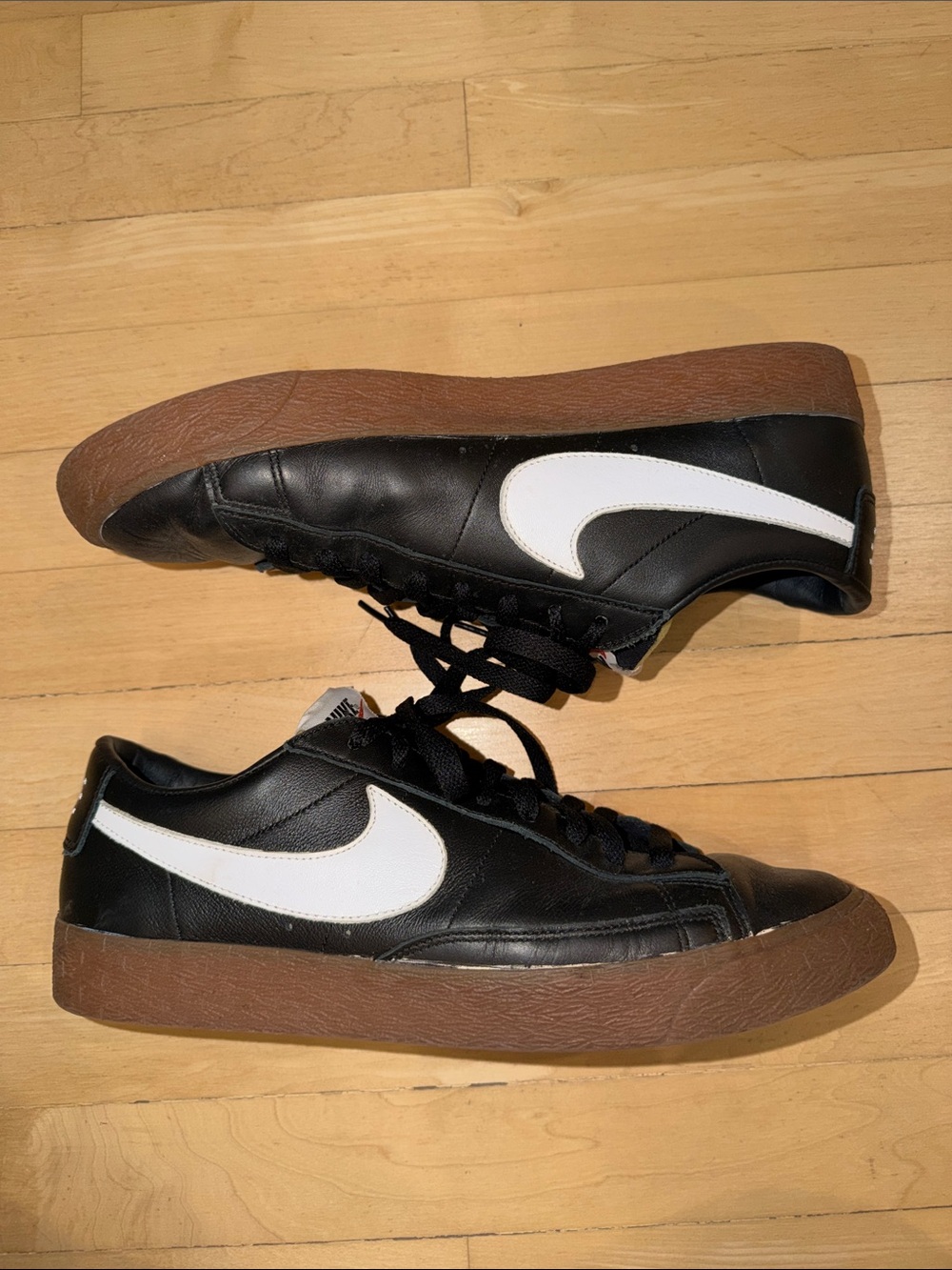 Nike Black Leather Sneakers with White Swoosh and Brown Gum Sole